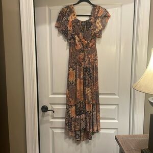 Angie floral long dress with ruffle and peep hole.